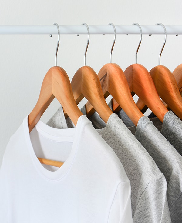 Light colored shirts on hangers